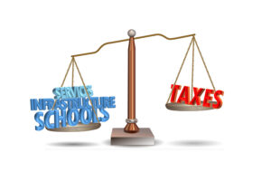 Scales with taxes balanced by schools, infrastructure and services